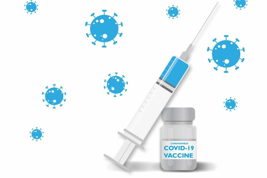 Strzykawka oparta o fiolkę ze szczepionką przeciw Covid-19.